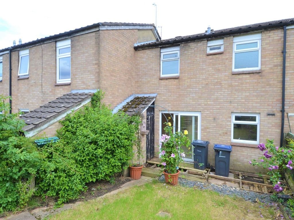 A sloped garden with a rotting deck. I guess the flowers were nice though! 