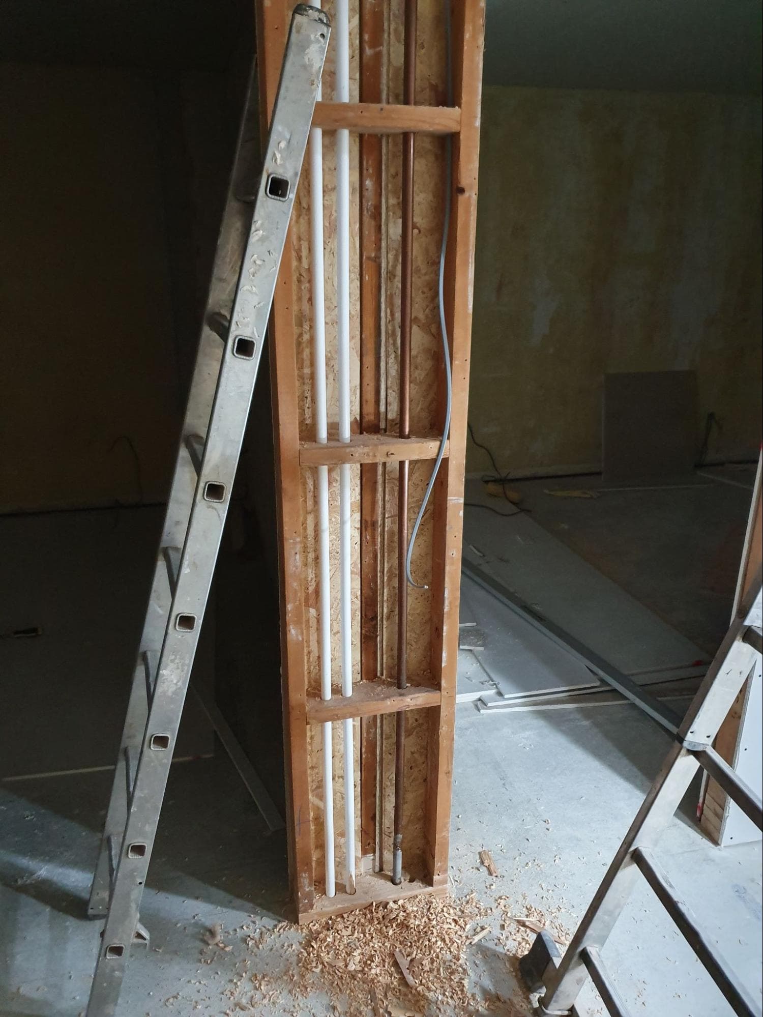 This little partition on the landing in the centre of the house was the perfect place to bring the main feed to and from the boiler (the copper pipe is the gas feed) 